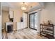 Bright kitchen with white cabinetry, stainless appliances, and a sliding door to the patio to expand the cooking space at 4250 S Olive St # 102, Denver, CO 80237