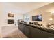 Inviting living room with a fireplace, TV, and comfortable sofa seating at 4250 S Olive St # 102, Denver, CO 80237