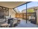 Covered patio area with outdoor seating and backyard access, ideal for relaxing and entertaining guests at 4250 S Olive St # 102, Denver, CO 80237