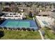 Aerial view of a community tennis court and pool, perfect for outdoor recreation at 4250 S Olive St # 102, Denver, CO 80237