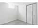 Finished basement with neutral carpet and closet at 8651 Franklin St, Denver, CO 80229