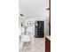 Bright kitchen with a black stainless steel refrigerator and breakfast nook area with table at 8651 Franklin St, Denver, CO 80229