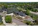 Beautiful aerial view of home showcasing lush landscaping, large yard, private drive and multiple outdoor spaces at 5859 E Ida Pl, Greenwood Village, CO 80111