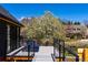 Back deck with seating area and beautiful views of the yard and neighborhood at 5859 E Ida Pl, Greenwood Village, CO 80111
