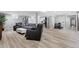 Open concept basement living area with flexible spaces for relaxation and recreation at 5859 E Ida Pl, Greenwood Village, CO 80111