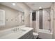 Well lit bathroom features modern fixtures, a bathtub, and a shower for a luxurious and relaxing experience at 5859 E Ida Pl, Greenwood Village, CO 80111