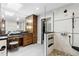Bathroom with dual sinks, walk-in shower, skylight, custom vanity, and neutral tones at 5859 E Ida Pl, Greenwood Village, CO 80111