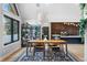 Dining area showcasing modern décor, hardwood floors, and a stylish light fixture at 5859 E Ida Pl, Greenwood Village, CO 80111