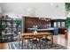 Dining area with a modern light fixture and adjacent kitchen with premium appliances at 5859 E Ida Pl, Greenwood Village, CO 80111