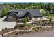 Stunning home featuring a modern design, lush landscaping, and inviting curb appeal at 5859 E Ida Pl, Greenwood Village, CO 80111