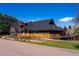 Exterior view of the property from the street showcasing its modern design and landscaping at 5859 E Ida Pl, Greenwood Village, CO 80111