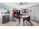 Home office space with an elegant wooden desk, complemented by a stylish cabinet and natural light at 5859 E Ida Pl, Greenwood Village, CO 80111