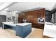 Modern kitchen boasts custom cabinetry, a center island with white countertops, and modern stainless steel appliances at 5859 E Ida Pl, Greenwood Village, CO 80111