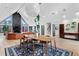 Open-concept living room showcasing hardwood floors, fireplace and modern décor at 5859 E Ida Pl, Greenwood Village, CO 80111