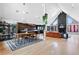 Open-concept living area featuring hardwood floors, fireplace, and dining area at 5859 E Ida Pl, Greenwood Village, CO 80111