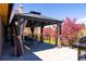 Outdoor patio under the gazebo with beautiful landscape views and dining set at 5859 E Ida Pl, Greenwood Village, CO 80111