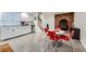 Finished basement offers retro-style kitchen cabinets, dining area and red-brick fireplace feature at 8229 Red Rock Pl, Larkspur, CO 80118