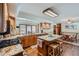 Charming kitchen with a granite island, breakfast bar seating, wood floors, granite countertops and natural light at 8229 Red Rock Pl, Larkspur, CO 80118