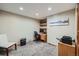 Comfortable office with a built-in desk, shelves, and carpet flooring at 8229 Red Rock Pl, Larkspur, CO 80118