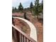 A walkway extends from the deck overlooking the landscape to a fenced in area at 8229 Red Rock Pl, Larkspur, CO 80118