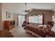 Spacious bedroom featuring vaulted ceilings, a ceiling fan, and large windows with backyard views at 1430 Bluefield Ave, Longmont, CO 80504