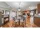 Breakfast nook features hardwood flooring and is adjacent to the kitchen and a fireplace at 1430 Bluefield Ave, Longmont, CO 80504