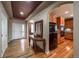 Inviting entryway showcasing hardwood floors, a console table, and seamless flow to other living spaces at 1430 Bluefield Ave, Longmont, CO 80504