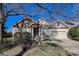 Attractive home with a well-maintained lawn, two-car garage, and appealing architectural elements at 1430 Bluefield Ave, Longmont, CO 80504