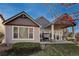 Rear exterior view featuring a covered patio, and a well-maintained lawn that enhances the home's curb appeal at 1430 Bluefield Ave, Longmont, CO 80504