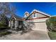 Inviting home exterior boasting a two-car garage, manicured landscaping, and stylish facade at 1430 Bluefield Ave, Longmont, CO 80504
