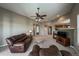 Cozy living room with fireplace and open access to the kitchen and dining area at 1430 Bluefield Ave, Longmont, CO 80504