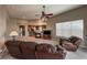 Inviting living room featuring a fireplace, neutral colors, vaulted ceilings, and seamlessly connected to the kitchen at 1430 Bluefield Ave, Longmont, CO 80504