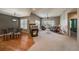 Open floor plan living room features a fireplace and sliding glass doors to the backyard at 1430 Bluefield Ave, Longmont, CO 80504