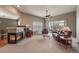 Comfortable living room with fireplace, ceiling fan, and sliding door access to the backyard at 1430 Bluefield Ave, Longmont, CO 80504