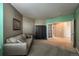 Spacious office features neutral tones, a comfortable couch, and access to an adjacent room through French doors at 1430 Bluefield Ave, Longmont, CO 80504