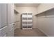Walk-in closet with built-in shelving at 1430 Bluefield Ave, Longmont, CO 80504