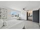 Spacious bedroom with en-suite bath, ceiling fan, and abundant natural light at 1973 Bahama St, Aurora, CO 80011