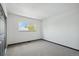 Well-lit bedroom showcasing a large window with ample natural light at 1973 Bahama St, Aurora, CO 80011