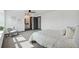 Sunlit bedroom with carpet floors, ceiling fan, and access to an en-suite bathroom at 1973 Bahama St, Aurora, CO 80011