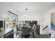 An inviting dining area with modern lighting fixtures and stairs nearby at 1973 Bahama St, Aurora, CO 80011