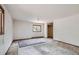 A spacious bedroom featuring a large window overlooking a wooded area, carpeting and closet at 1645 Little Bear Creek Rd, Idaho Springs, CO 80452