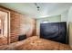 A bedroom with wood paneling on one wall, tan carpet, and log cabin aesthetics at 1645 Little Bear Creek Rd, Idaho Springs, CO 80452