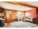 Wood paneled living room featuring wood-burning stove and natural lighting at 1645 Little Bear Creek Rd, Idaho Springs, CO 80452