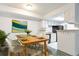 Cozy dining area open to the kitchen, perfect for entertaining or intimate meals, with modern decor at 14454 E Colorado Dr # 103, Aurora, CO 80012