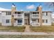 Charming condo complex featuring two-story units, private balconies, and well-maintained landscaping at 14454 E Colorado Dr # 103, Aurora, CO 80012