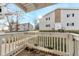 Exterior view showcasing a private balcony with a bright and sunny view of the well-kept yard at 14454 E Colorado Dr # 103, Aurora, CO 80012