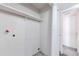 Functional laundry room with washer and dryer hookups, along with storage shelf and closet access at 14454 E Colorado Dr # 103, Aurora, CO 80012