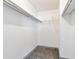 Spacious walk-in closet providing ample storage with both hanging racks and wire shelving at 14454 E Colorado Dr # 103, Aurora, CO 80012