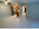 Spacious, open-concept living room with stainless steel appliances, tile floor and great natural light at 100 E Highline Cir # 105, Centennial, CO 80122