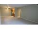 Bright living room featuring tile flooring and neutral paint, connected to a modern kitchen at 100 E Highline Cir # 105, Centennial, CO 80122